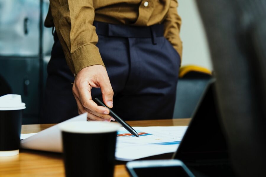 people standing up in a meeting