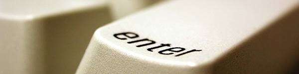 Close up of an Enter key on a white keyboard