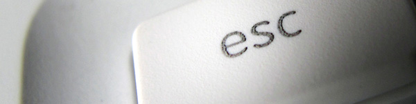 Close up of an ESC key on a white keyboard