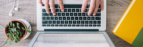 Person typing on a laptop