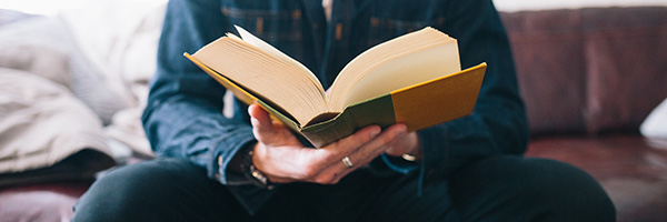 Man holding open a book