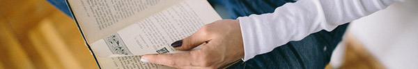 Photo of a person reading a book