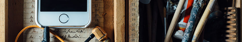 A mobile phone on a workshop table