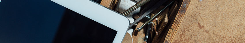 A tablet on a workshop bench