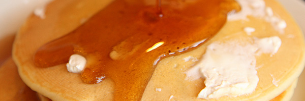 Pancakes covered with maple syrup