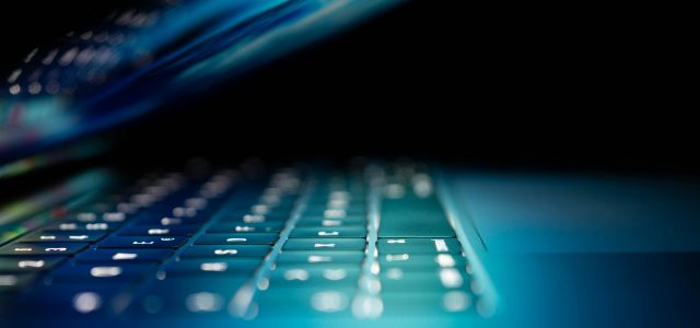 Keyboard on a dimly lit laptop